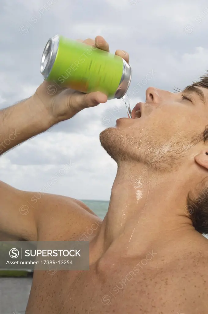 Close-up of a man drinking soda