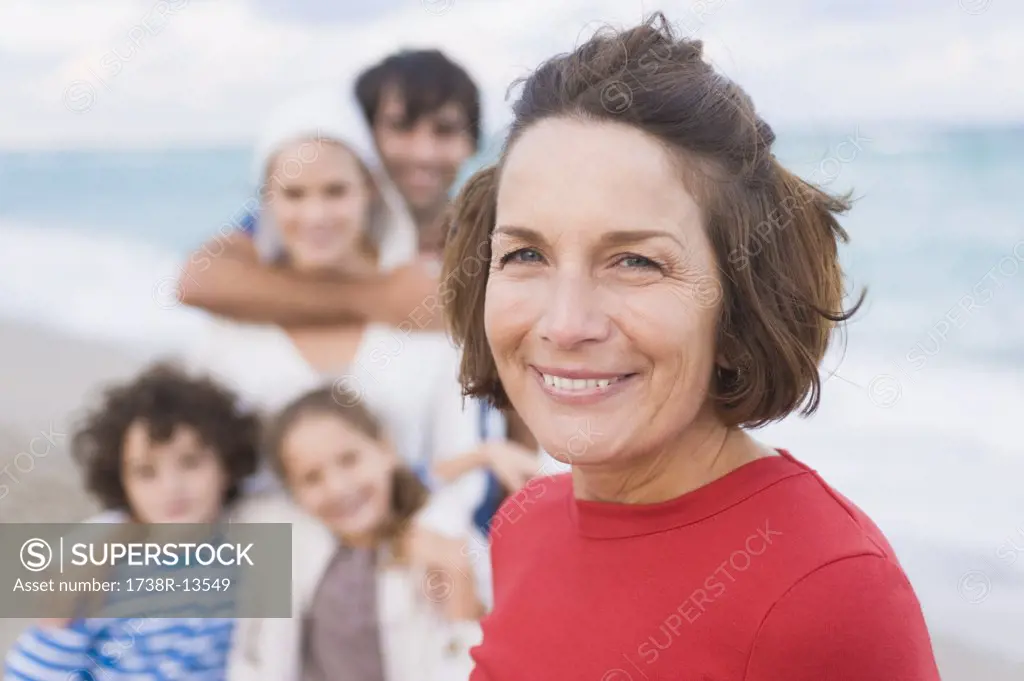 Woman smiling with her family on the beach
