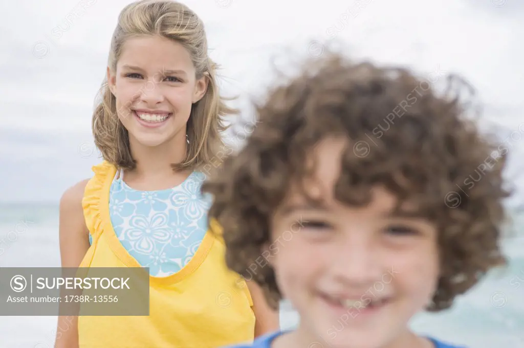 Boy smiling with a girl on the beach