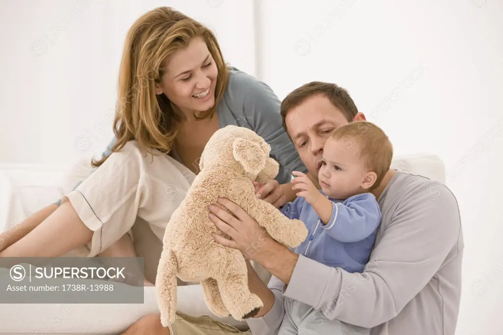 Parents playing with their daughter