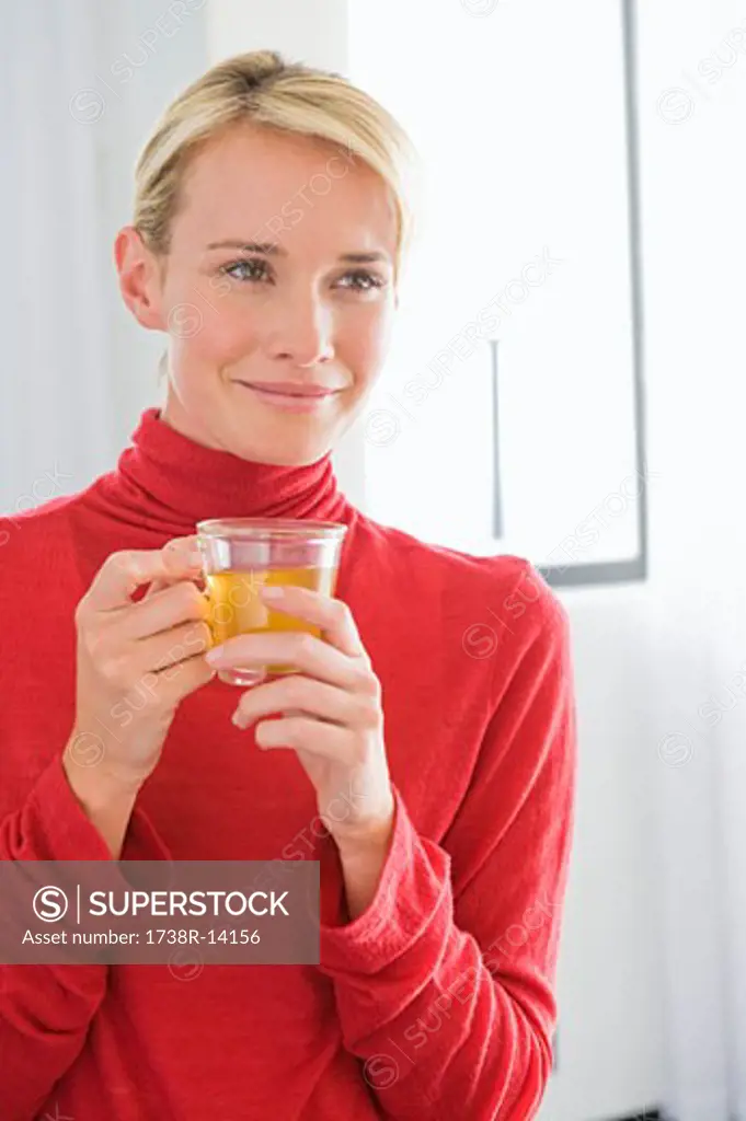 Close-up of a woman holding a cup of tea