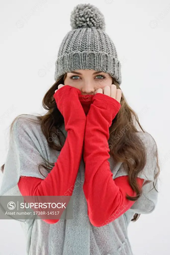 Portrait of a woman covering her face