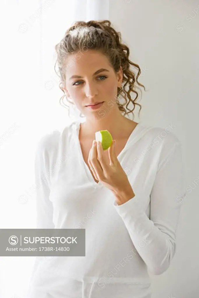 Close-up of a woman eating fruit