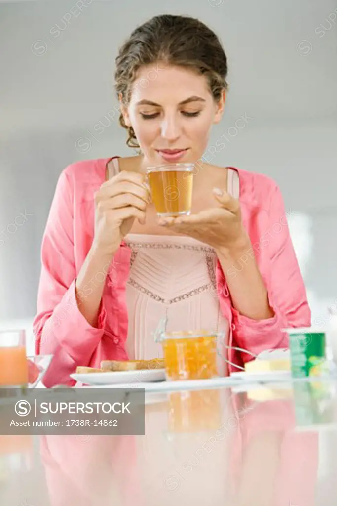 Woman having breakfast at a table