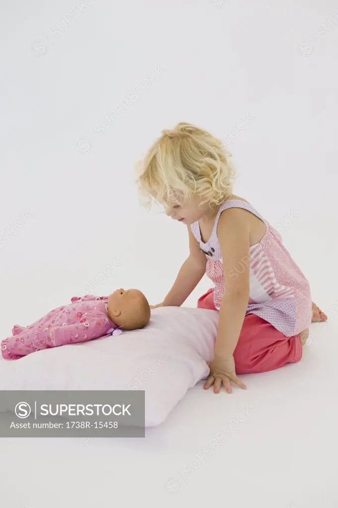 Girl playing with a doll