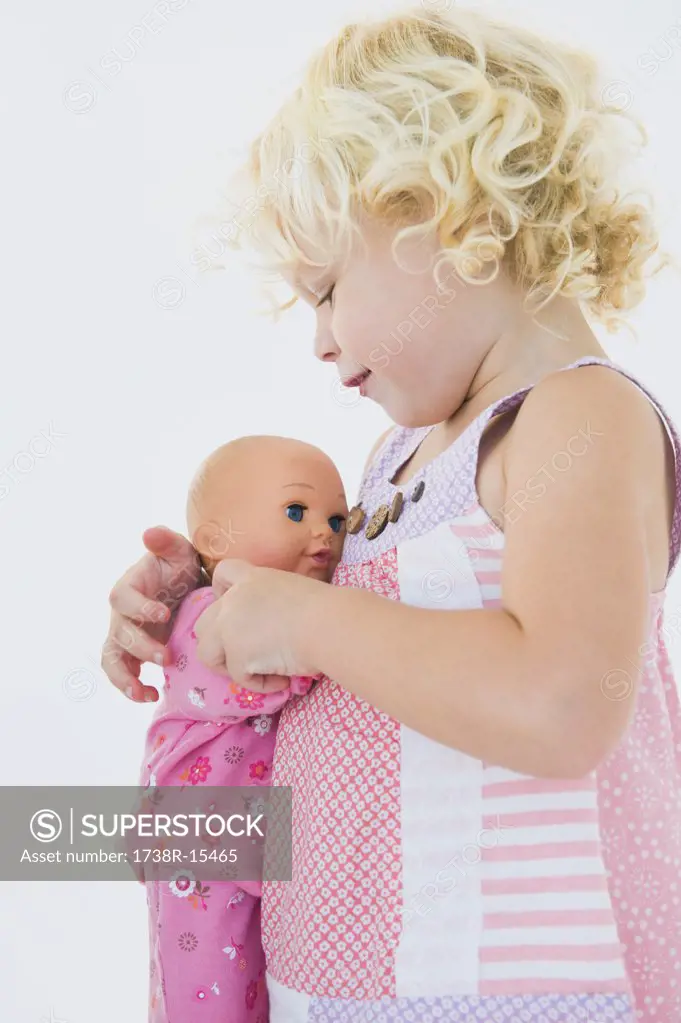 Girl hugging a doll