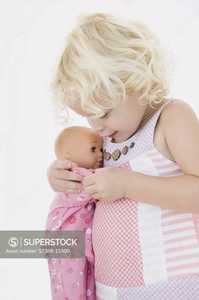 Girl hugging a doll