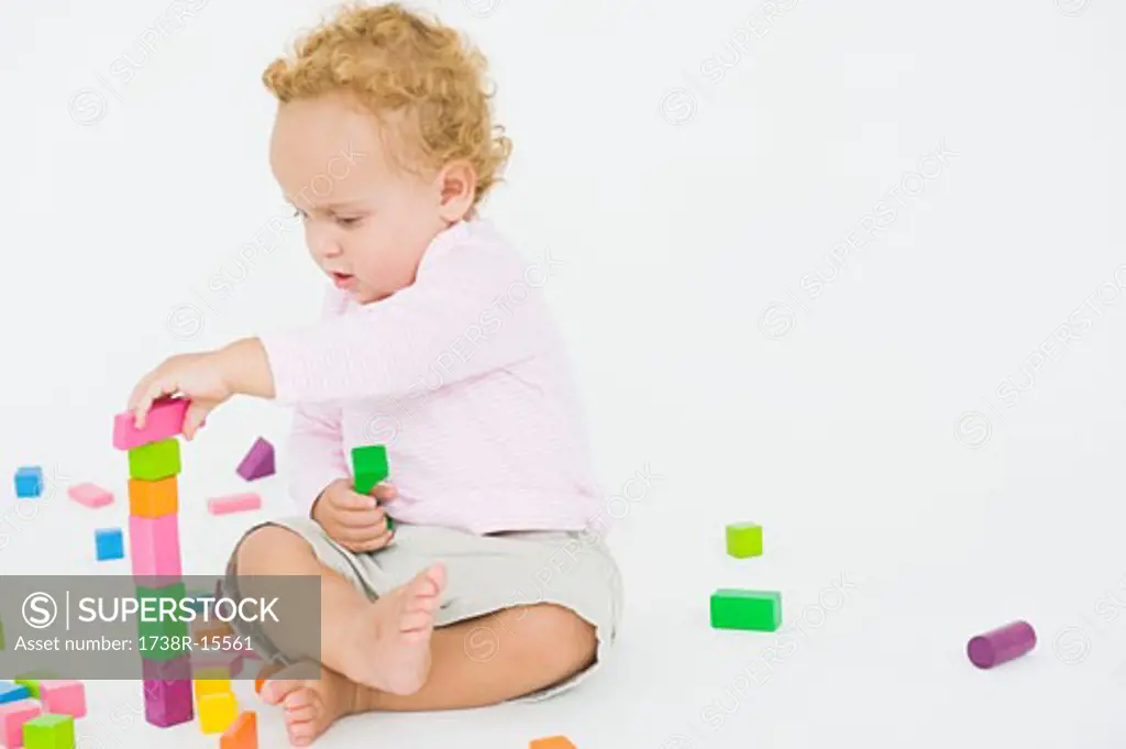 Baby boy playing with blocks