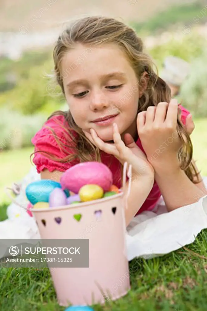 Girl looking at Easter eggs