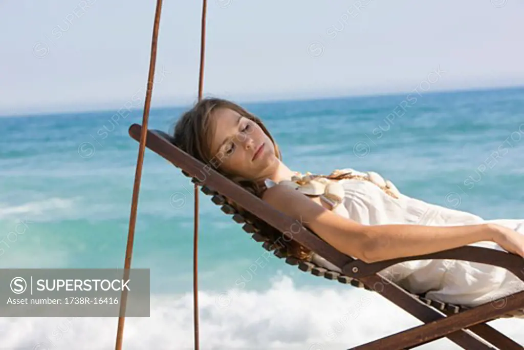 Woman resting in a deck chair