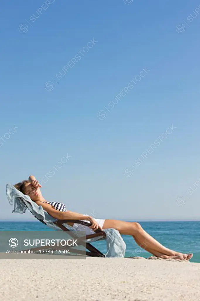 Woman resting in a deck chair