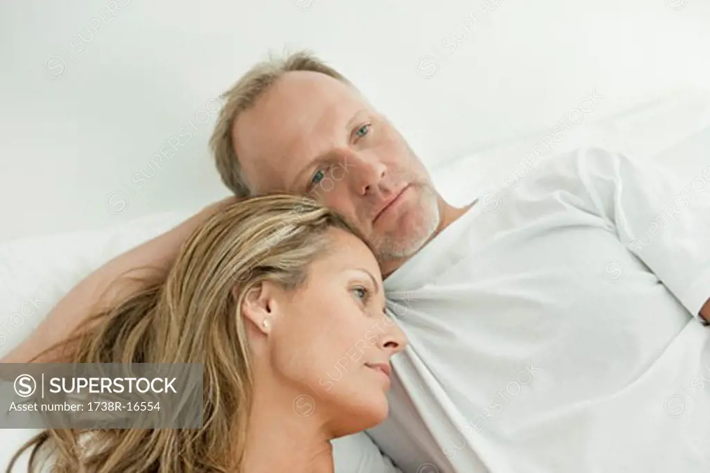 Couple resting on the bed