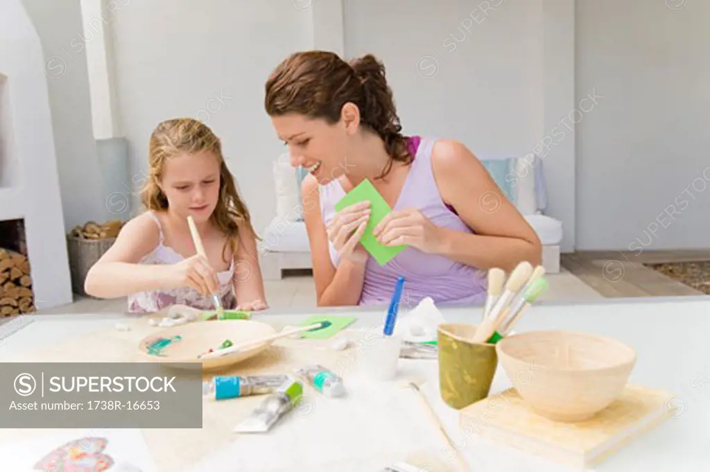 Woman teaching her daughter