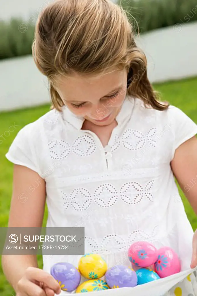 Girl carrying Easter eggs