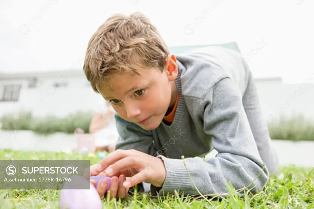 Boy looking at an Easter egg