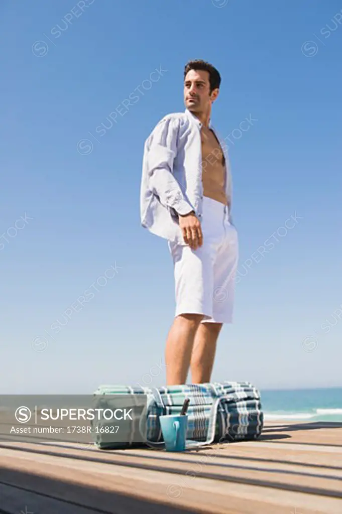 Man standing on a boardwalk