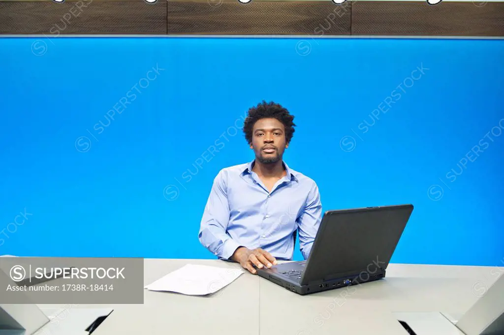 Businessman working on a laptop in a conference room