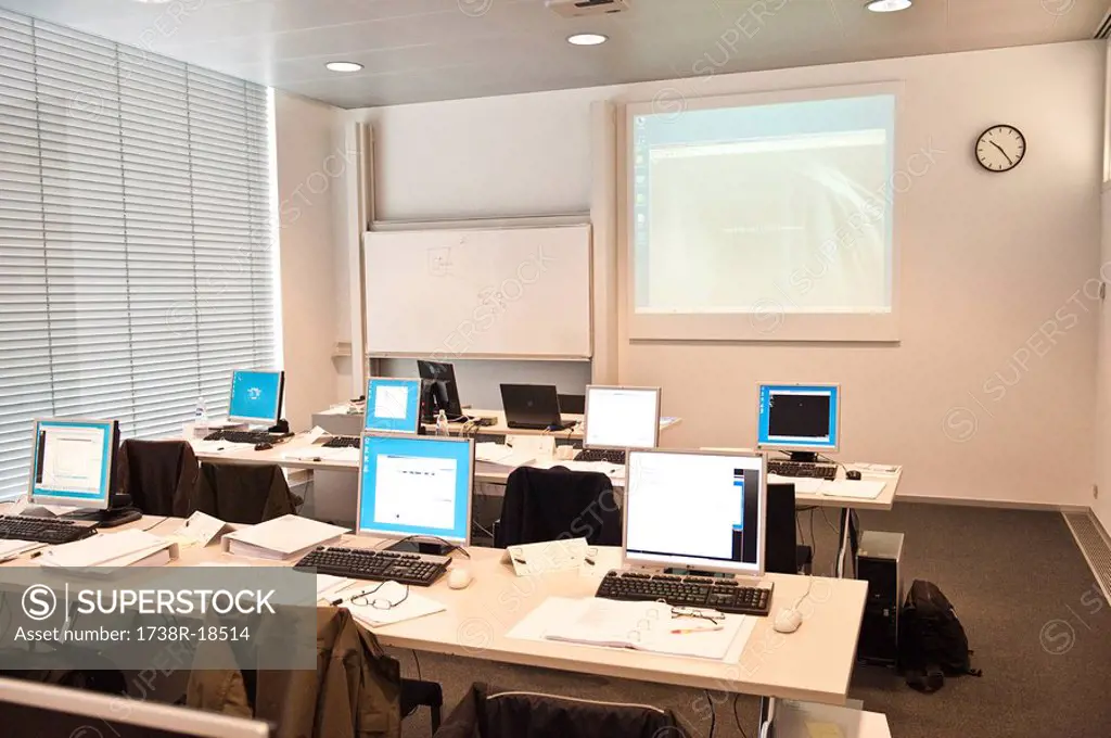 Computers on tables in a classroom