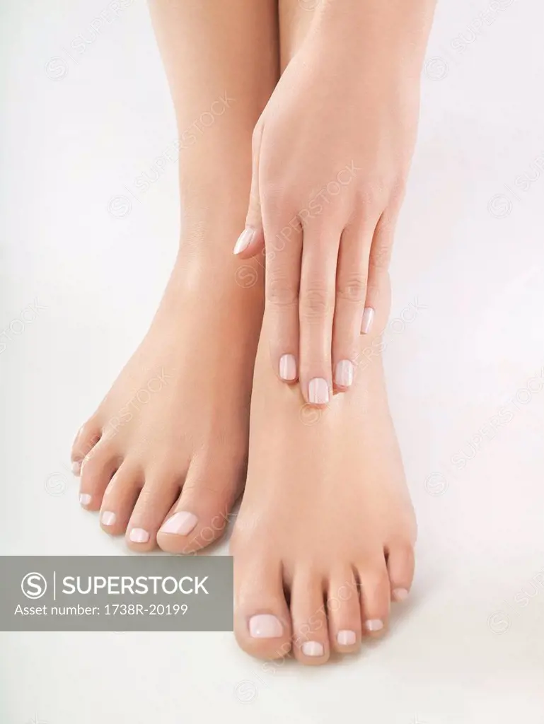 Woman rubbing her foot, close_up