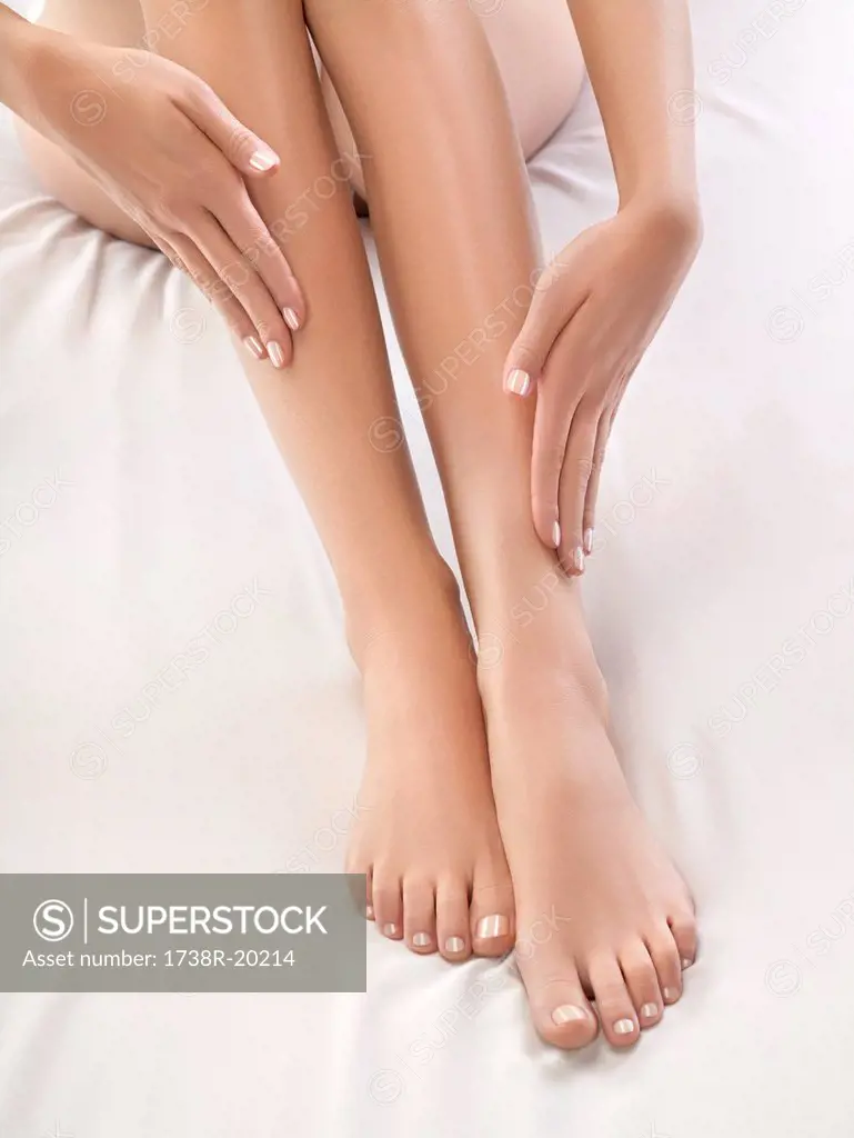 Woman touching her legs
