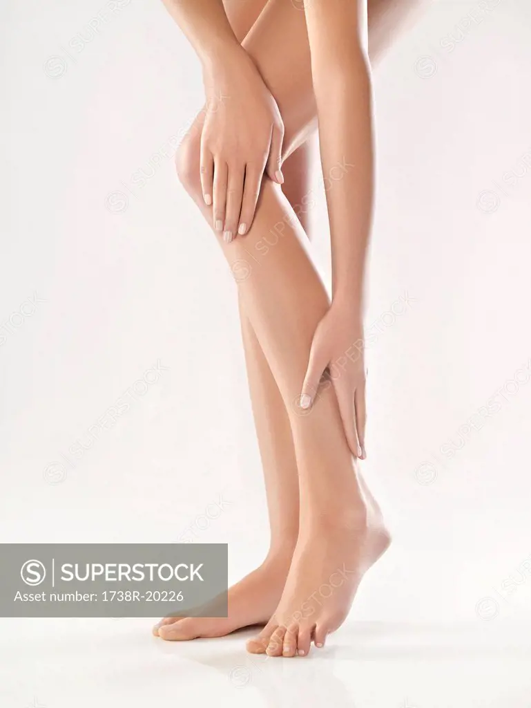 Woman touching her legs