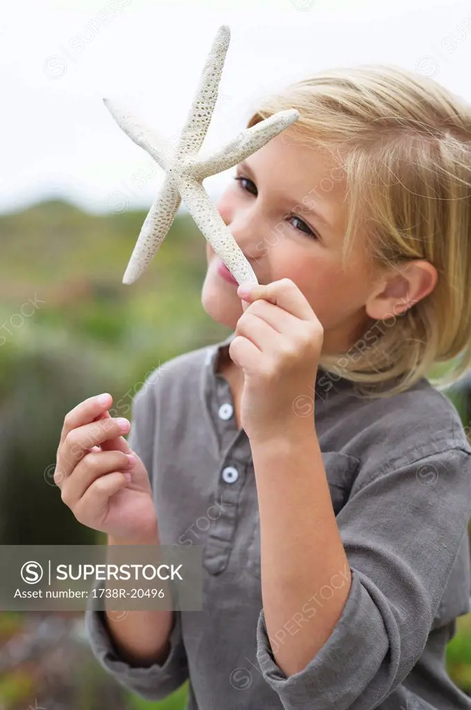 Close_up of a girl smelling a star shaped toy