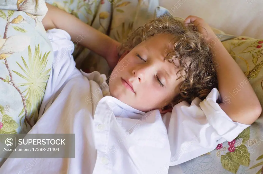 Little boy sleeping on couch