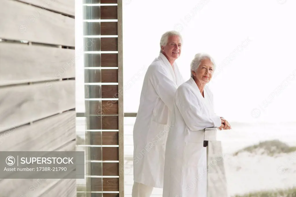 Senior couple standing at a balcony