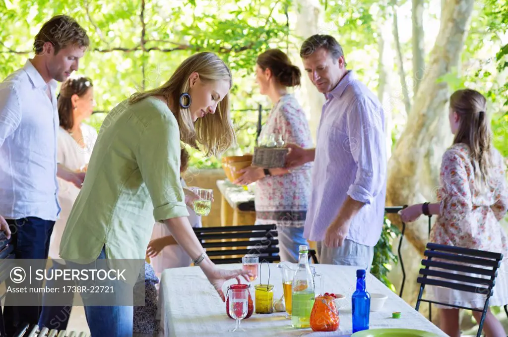 Family cleaning table after having food at house
