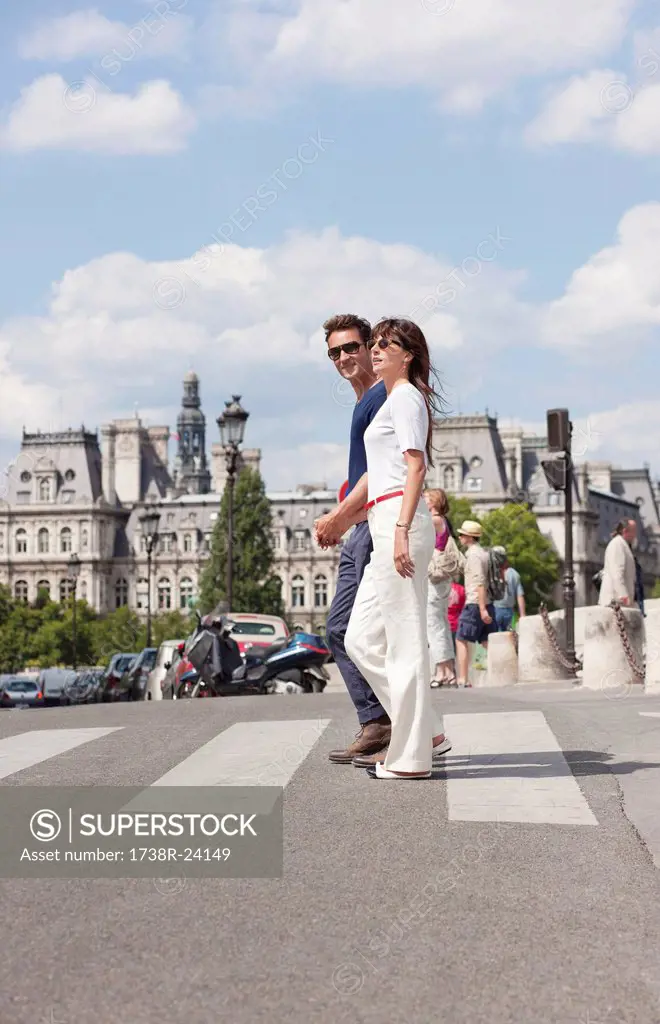 Couple crossing the road, Paris, Ile_de_France, France