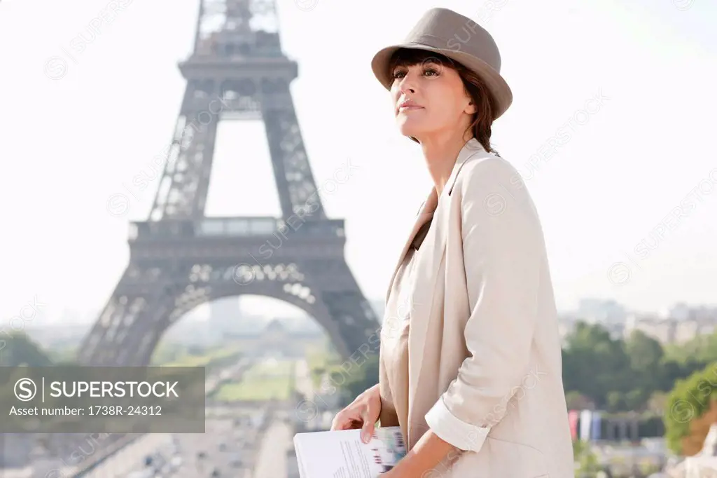 Profile of a woman with the Eiffel Tower in the background, Paris, Ile_de_France, France