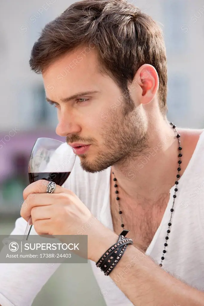 Close_up of a man drinking red wine, Paris, Ile_de_France, France