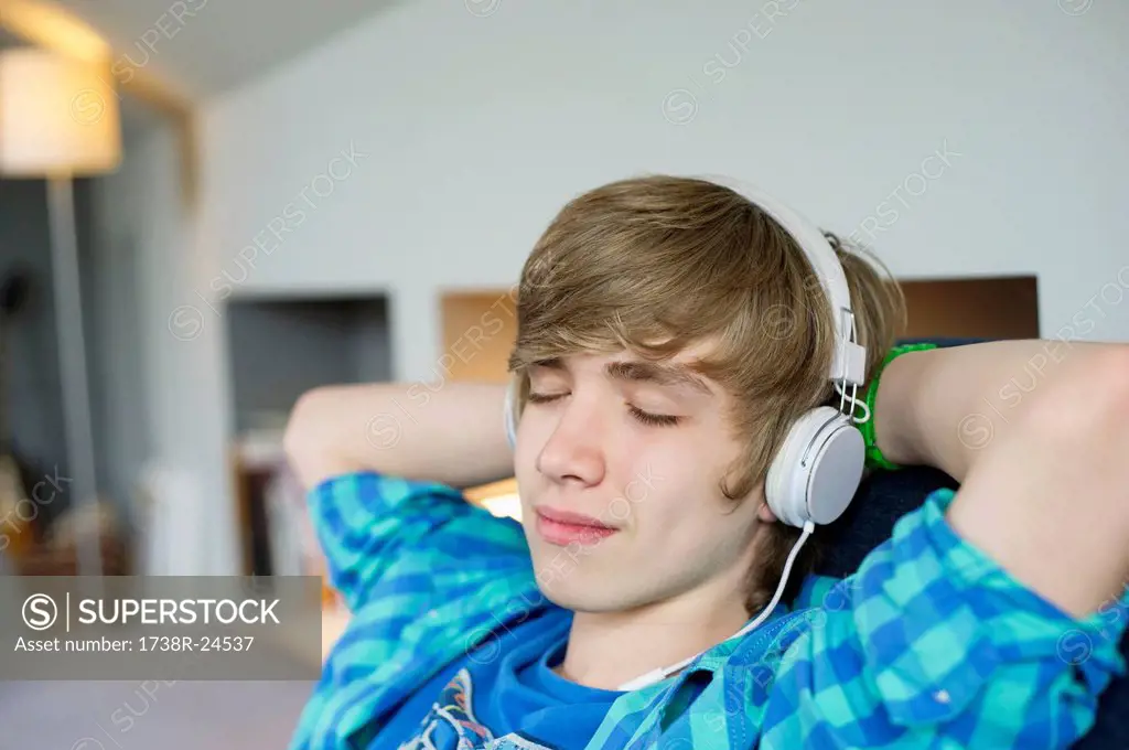 Teenage boy listening to music