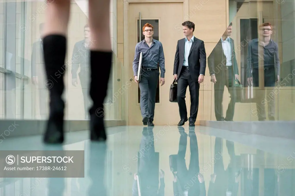 Business executives walking in a corridor