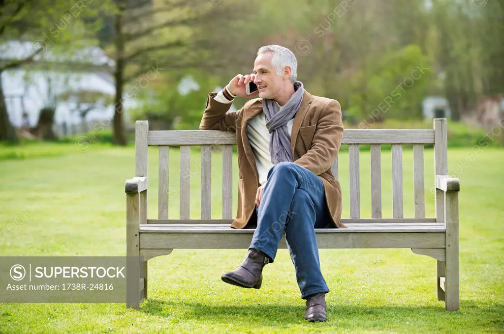 Man talking on a mobile phone in a park
