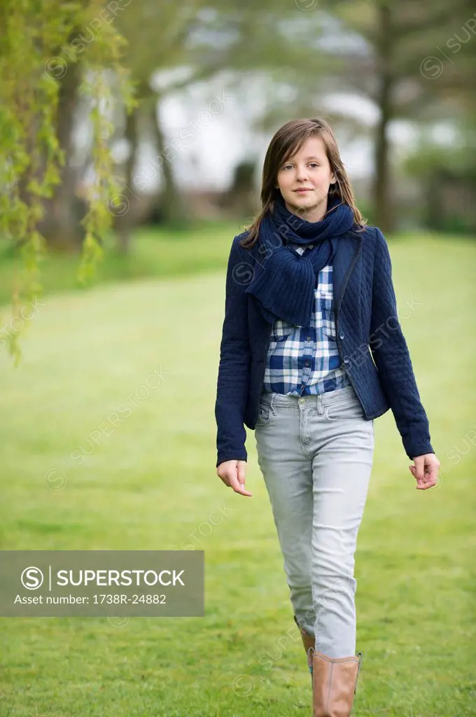 Girl walking in a field