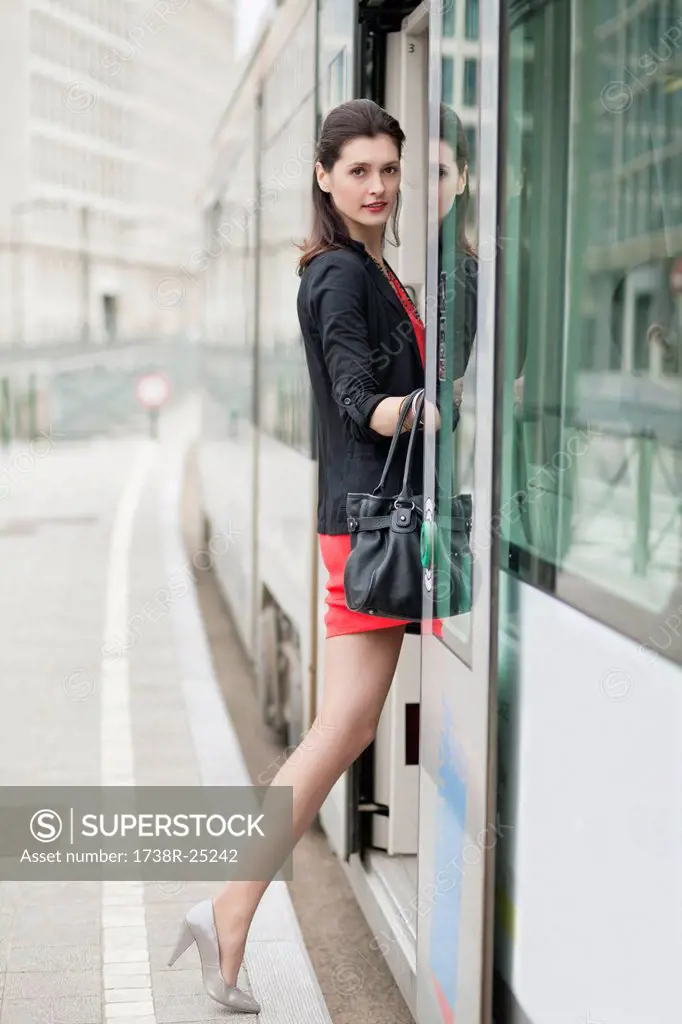 Woman boarding a tram
