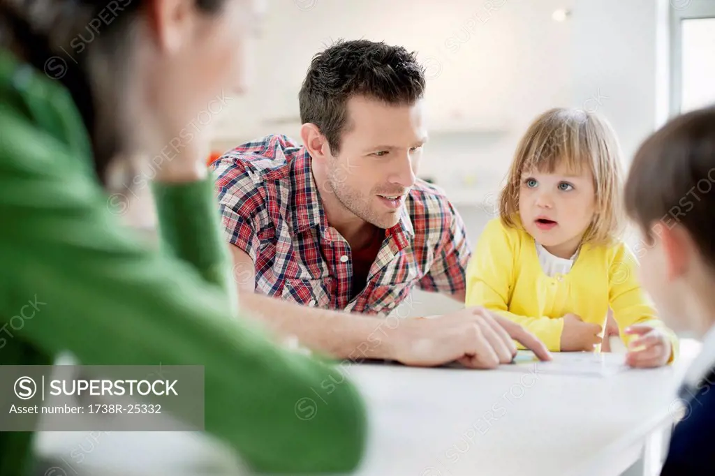 Couple teaching their children at home