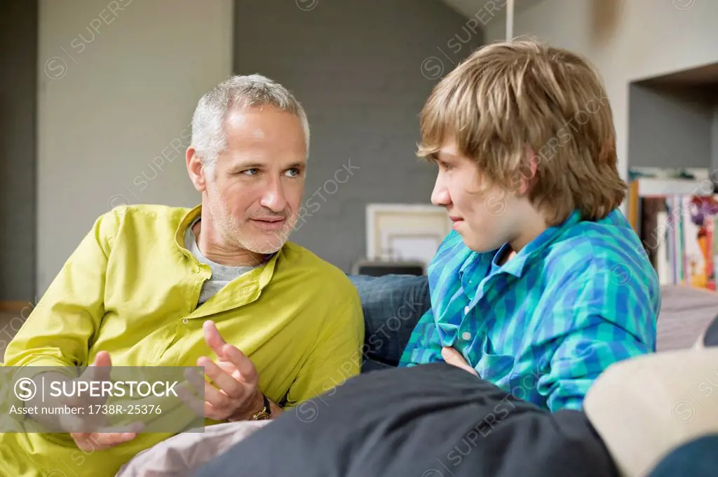 Man talking with his son at home