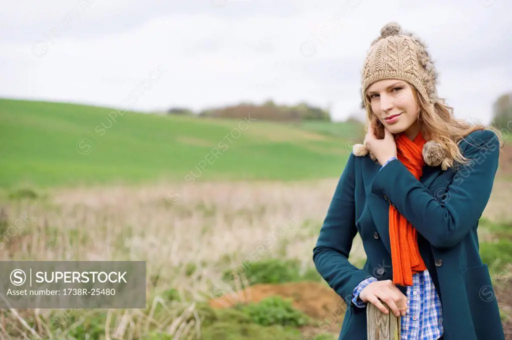 Portrait of a woman standing in a field
