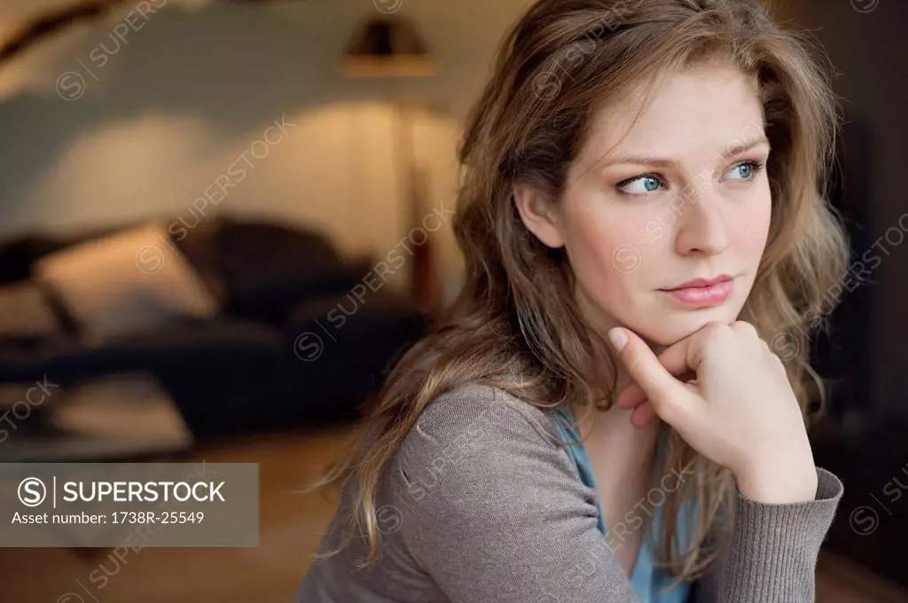 Close_up of a beautiful woman thinking