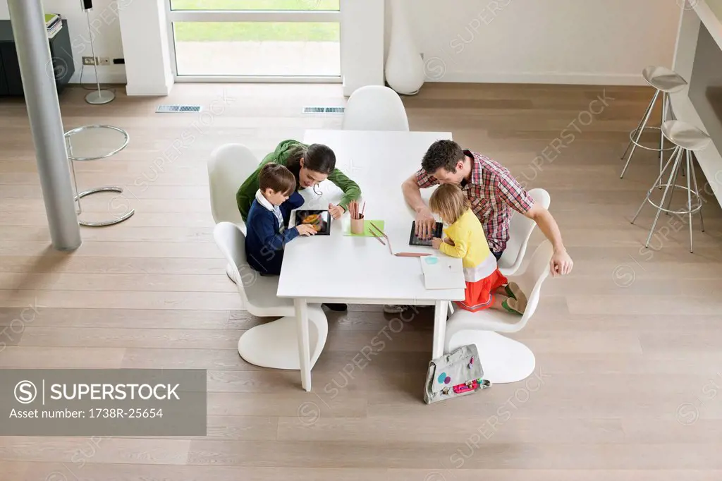 High angle view of couple teaching their children