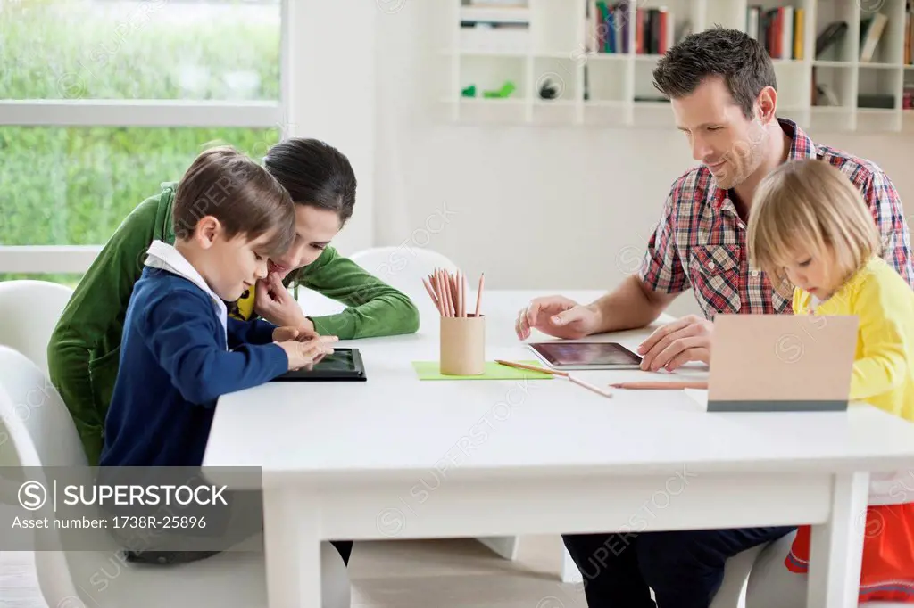 Couple teaching their children at home