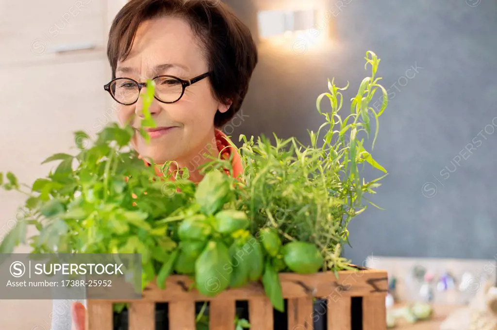 Woman smelling plants