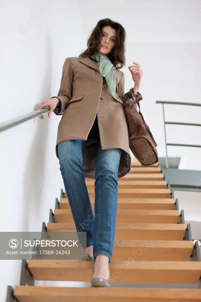 Woman moving down stairs