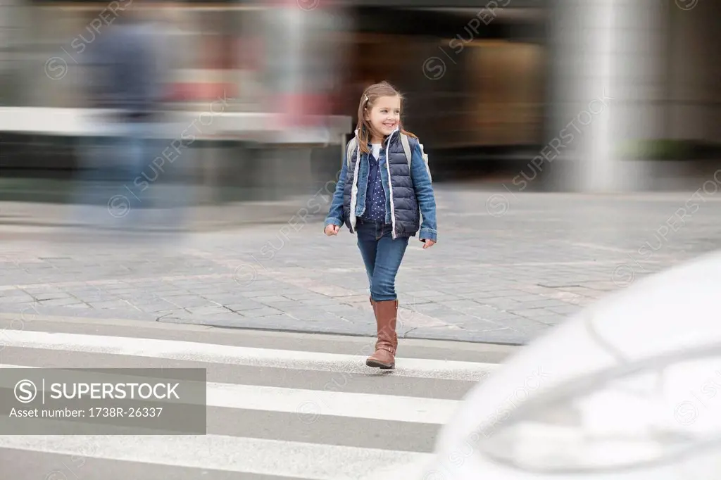 Schoolgirl crossing a road