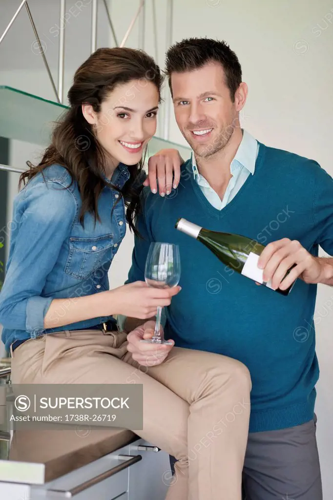 Couple drinking wine in the kitchen