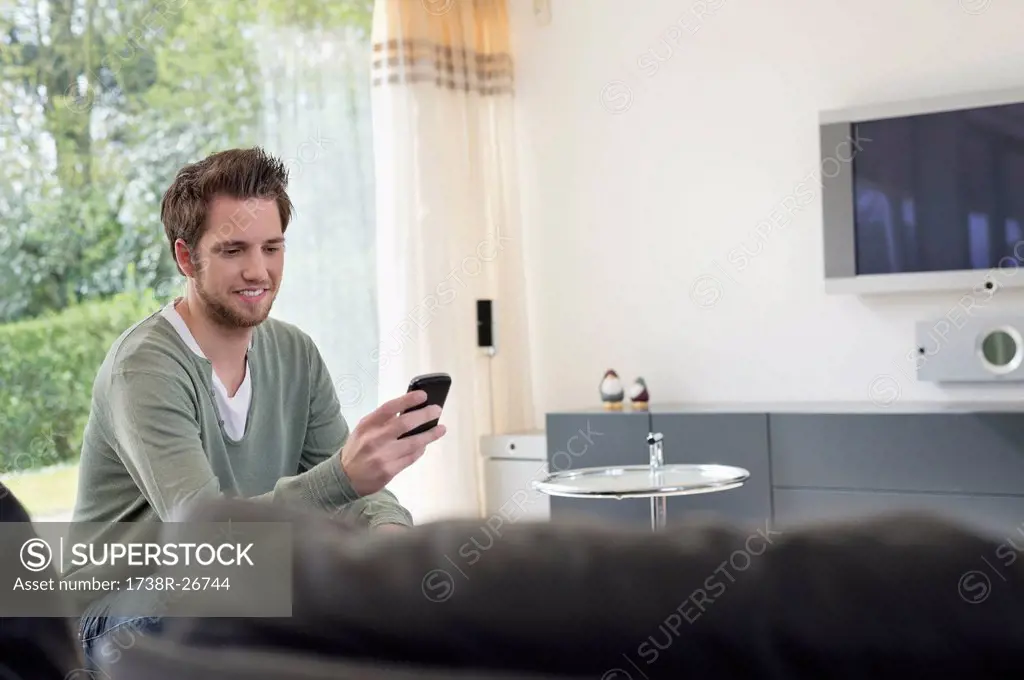 Man reading a text message on mobile phone