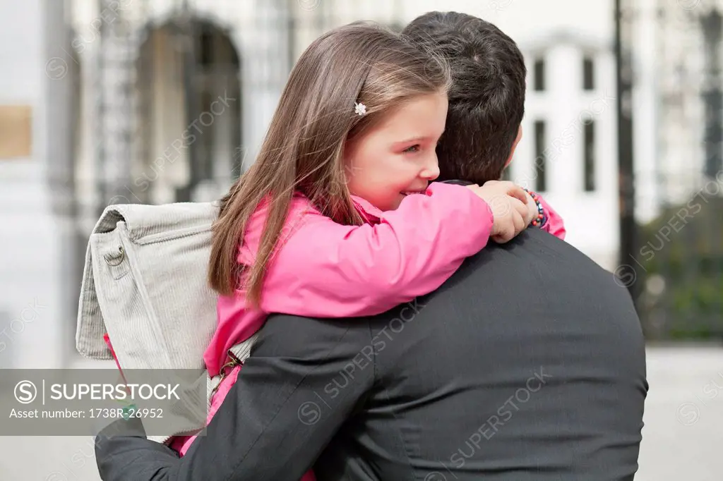 Girl hugging her father