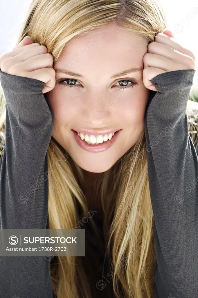 Portrait of young woman frowning